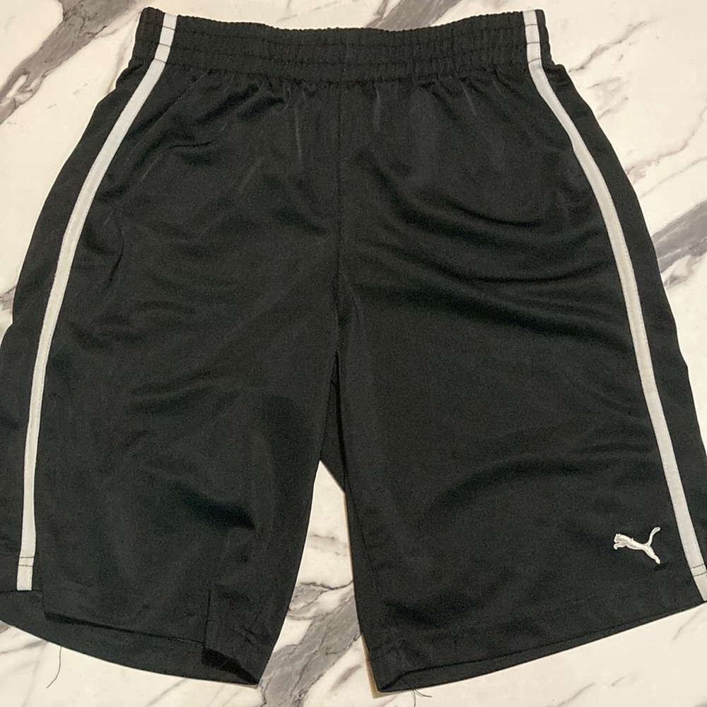 Selling Black puma shorts with white lines